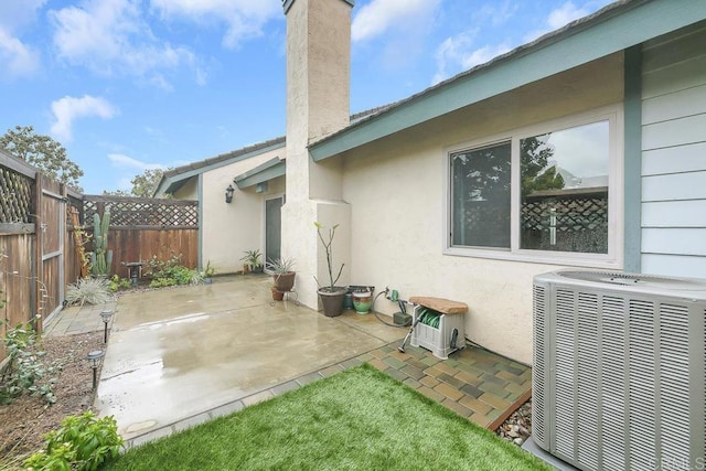 view of patio / terrace featuring fence private yard and central AC