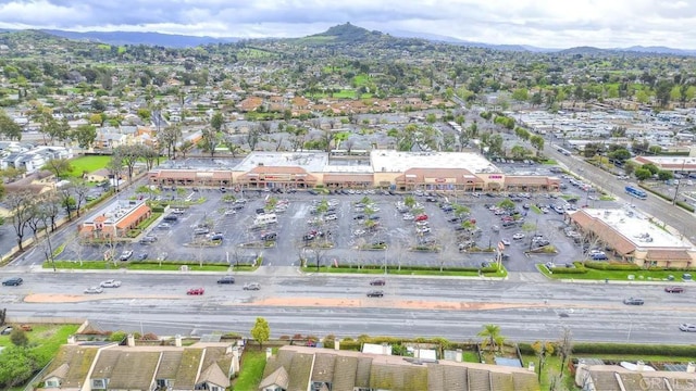 birds eye view of property with a mountain view