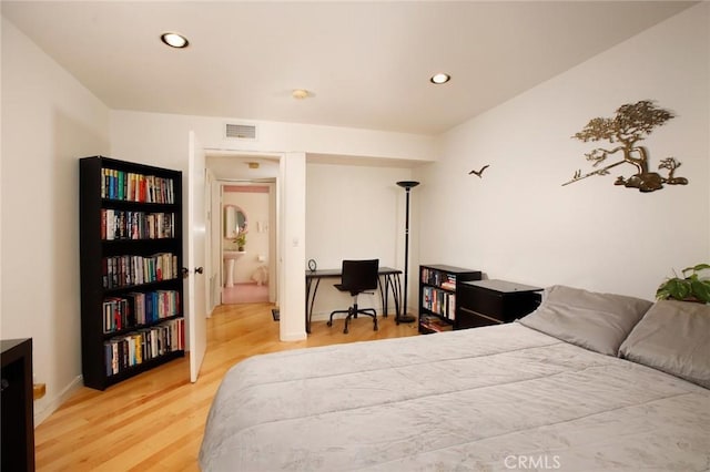 bedroom featuring recessed lighting, wood finished floors, and visible vents