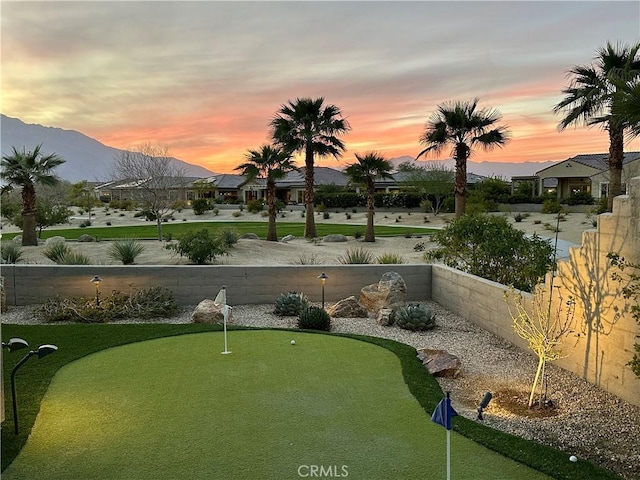 view of yard with a fenced backyard and a mountain view