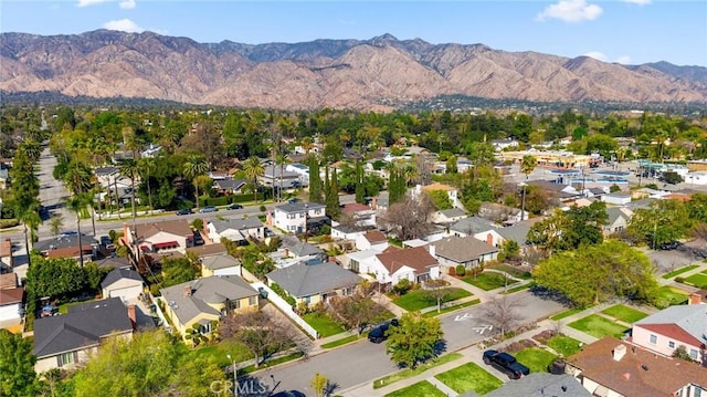 drone / aerial view with a residential view and a mountain view