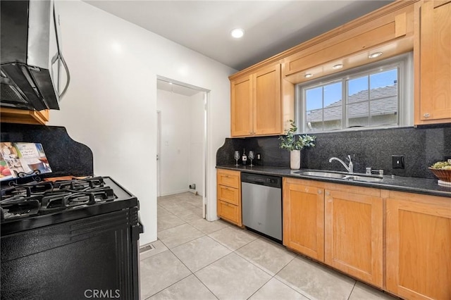 kitchen with a sink, backsplash, black gas range, light tile patterned floors, and stainless steel dishwasher