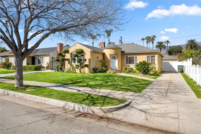 single story home with stucco siding, driveway, fence, a front yard, and a chimney