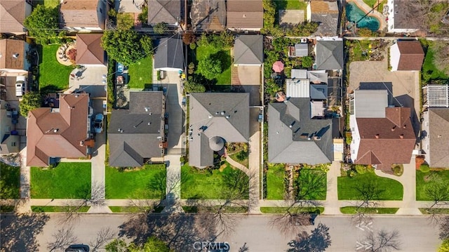 birds eye view of property with a residential view