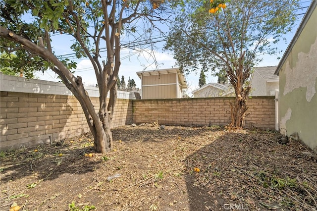 view of yard with a fenced backyard