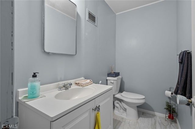 half bath featuring visible vents, baseboards, toilet, marble finish floor, and vanity