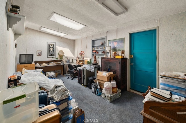 office area featuring lofted ceiling, a textured ceiling, and carpet flooring