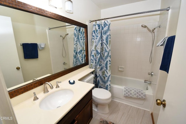 full bathroom featuring toilet, vanity, and shower / bath combo