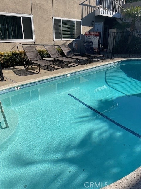 pool with a patio area