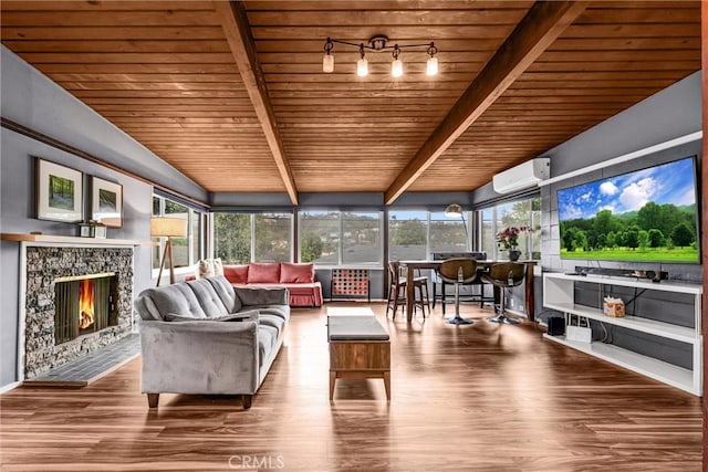 sunroom with beamed ceiling, plenty of natural light, an AC wall unit, and wood ceiling