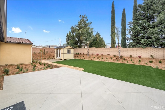 view of patio / terrace featuring an outdoor structure and a fenced backyard