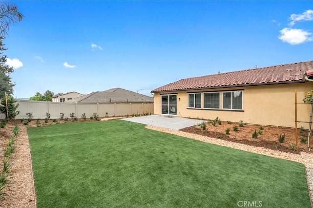 view of yard featuring a patio and a fenced backyard