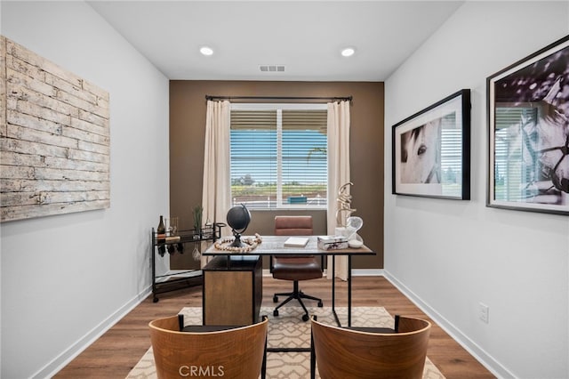 home office featuring visible vents, recessed lighting, baseboards, and wood finished floors