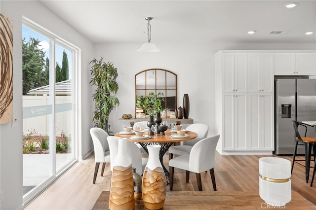 dining room with recessed lighting, visible vents, and light wood finished floors