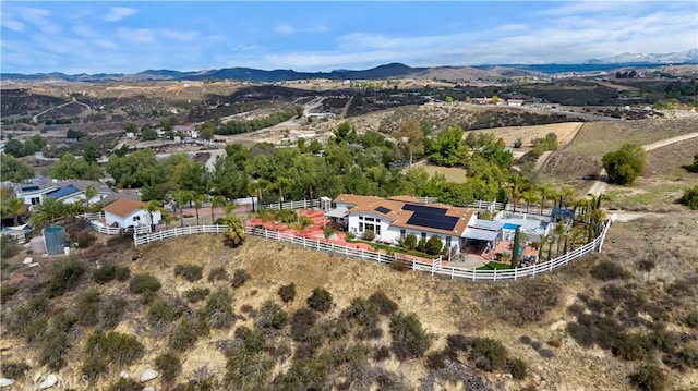 birds eye view of property featuring a mountain view