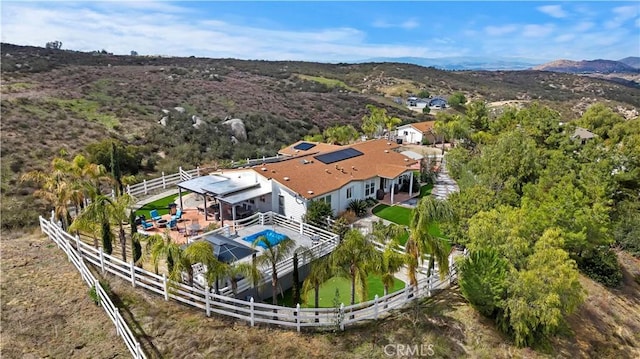 birds eye view of property featuring a mountain view