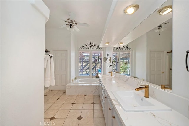 full bathroom with a ceiling fan, double vanity, a sink, tile patterned floors, and a bath