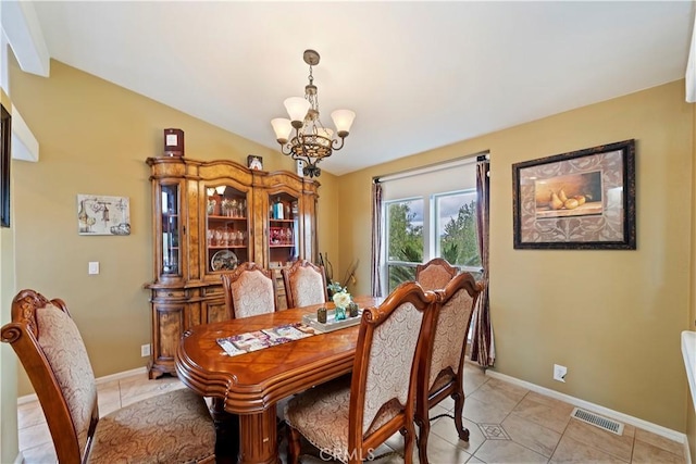 dining space with visible vents, baseboards, an inviting chandelier, and light tile patterned flooring