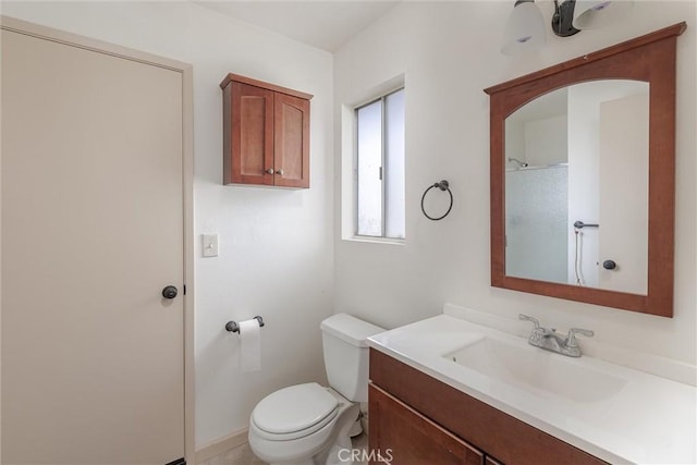 bathroom with toilet and vanity