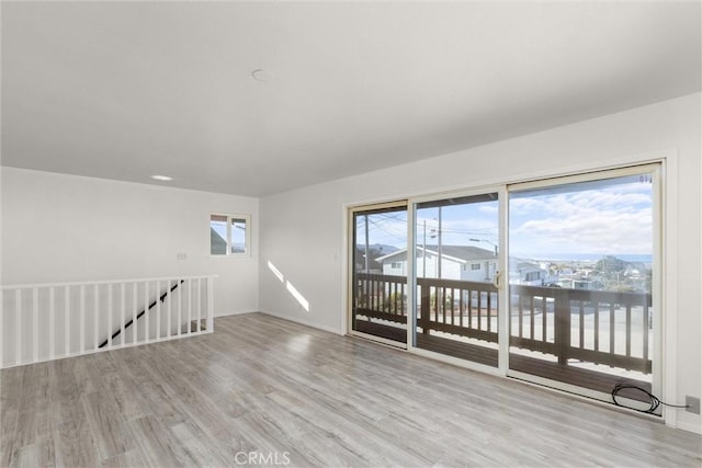 spare room with light wood-style flooring