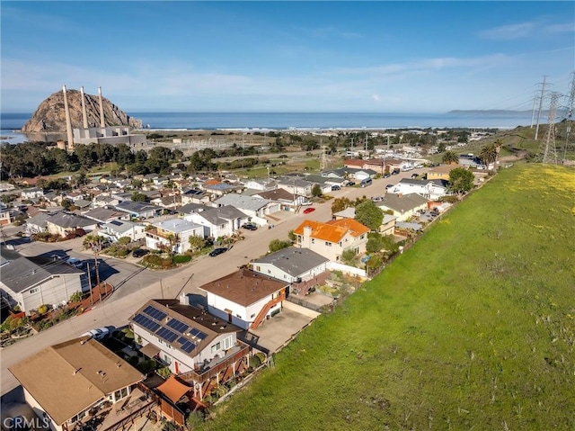 drone / aerial view with a water view and a residential view