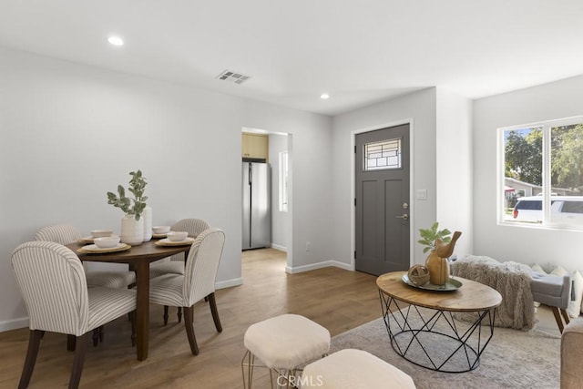 interior space with light wood finished floors, visible vents, recessed lighting, and baseboards