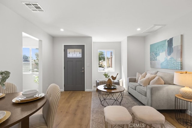 11541 Basye St, El Monte, CA 91732 - living area with light wood finished floors, visible vents, recessed lighting, and baseboards