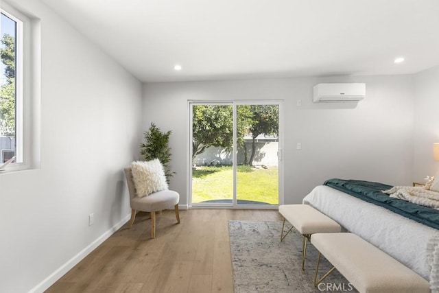 11541 Basye St, El Monte, CA 91732 - bedroom with a wall unit AC, multiple windows, wood finished floors, and recessed lighting
