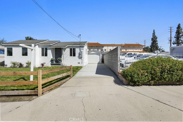 11541 Basye St, El Monte, CA 91732 - view of front of home with stucco siding, fence, an outdoor structure, a front yard, and a garage