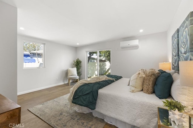 11541 Basye St, El Monte, CA 91732 - bedroom featuring a wall unit AC, multiple windows, wood finished floors, and recessed lighting