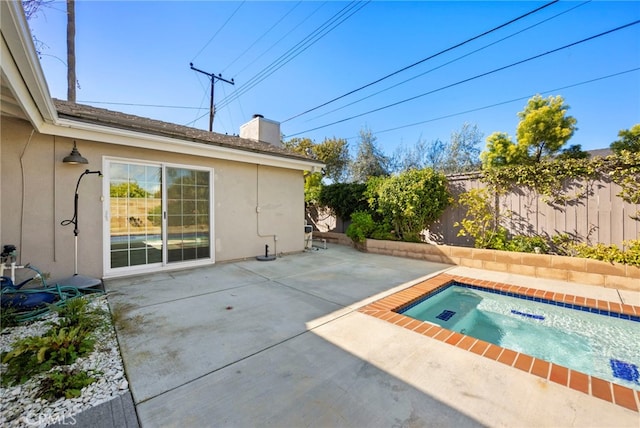 view of swimming pool with a patio and a fenced backyard