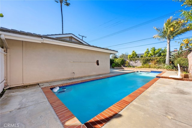 view of pool featuring a patio area and a fenced in pool