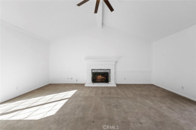 unfurnished living room featuring carpet flooring, a fireplace, vaulted ceiling with beams, and ceiling fan