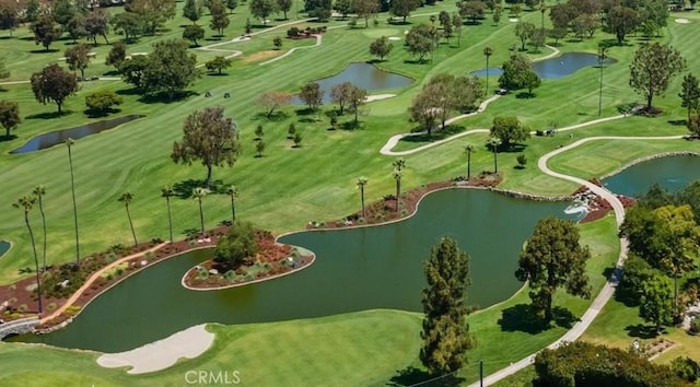 aerial view featuring golf course view and a water view