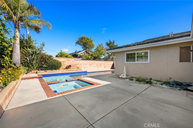 view of swimming pool with a fenced in pool, a patio, an in ground hot tub, and a fenced backyard