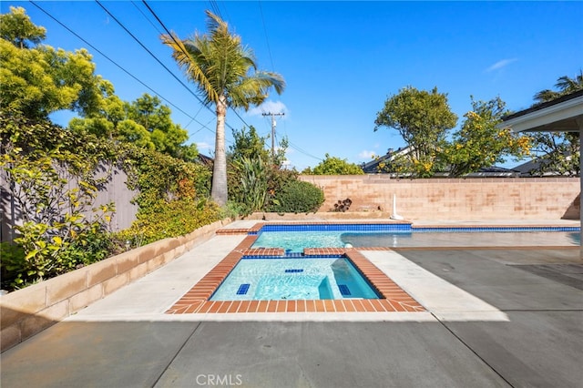 view of swimming pool with a fenced in pool, a fenced backyard, and a patio area