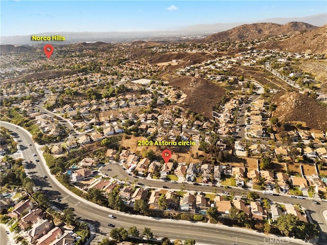 aerial view with a mountain view and a residential view