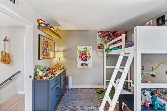 bedroom with visible vents and baseboards