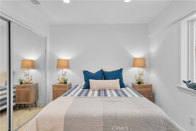 carpeted bedroom featuring a closet