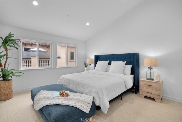 bedroom with light carpet, recessed lighting, baseboards, and vaulted ceiling