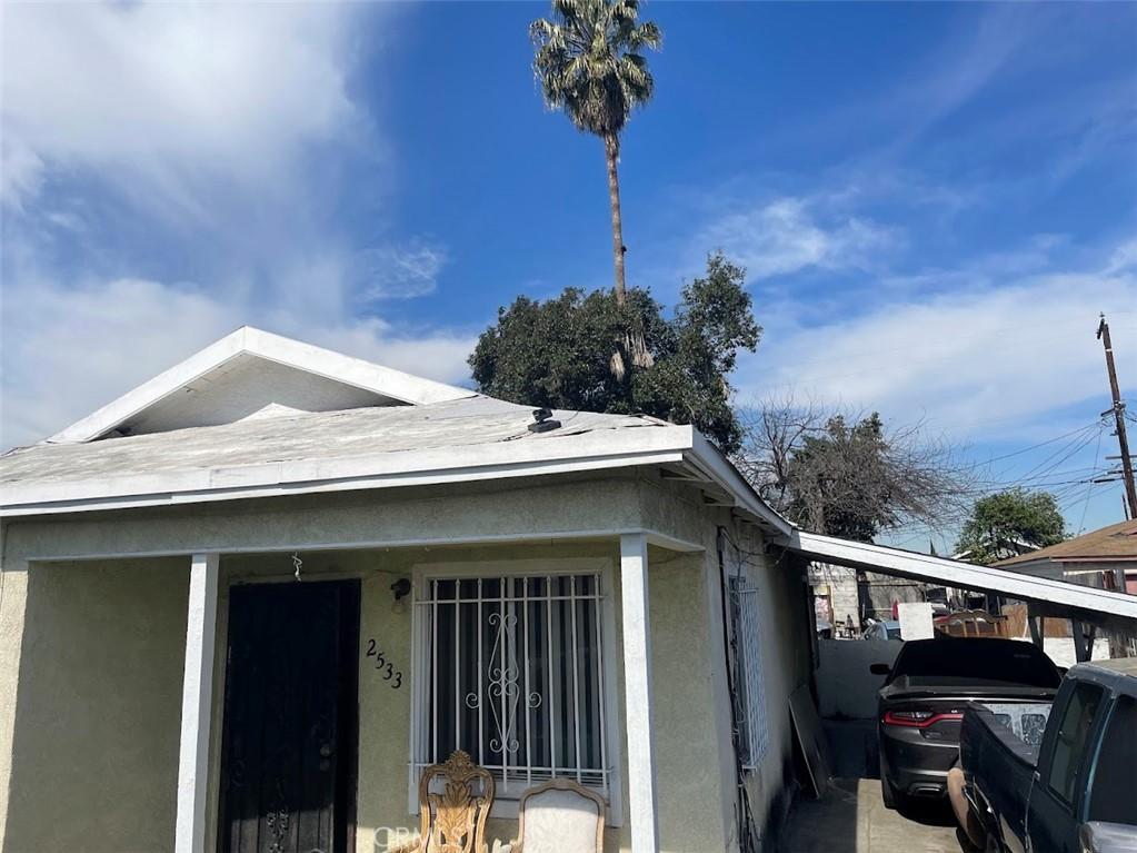 view of home's exterior with a carport and stucco siding