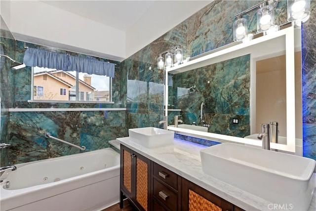 full bath featuring double vanity, a whirlpool tub, and a sink