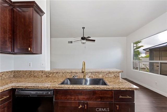 kitchen featuring ceiling fan, dark brown cabinetry, black dishwasher, light stone counters, and a sink