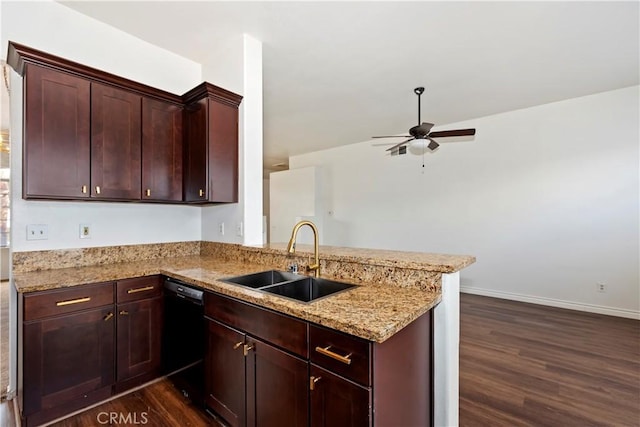 kitchen with light stone counters, ceiling fan, a sink, dark wood-type flooring, and black dishwasher