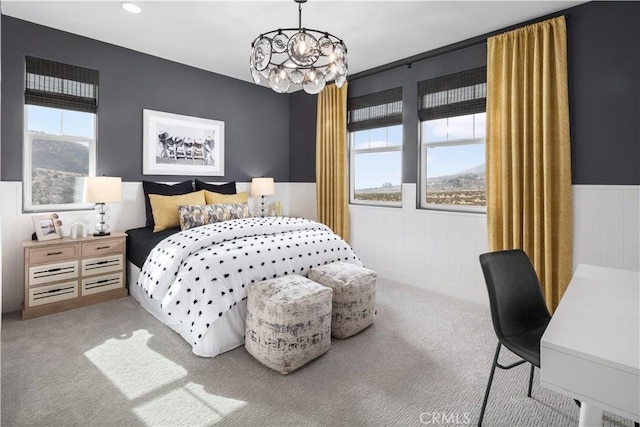 bedroom featuring recessed lighting, a notable chandelier, wainscoting, and carpet floors