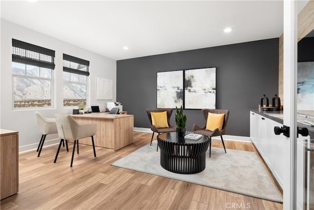 office area with recessed lighting, light wood-style floors, and baseboards