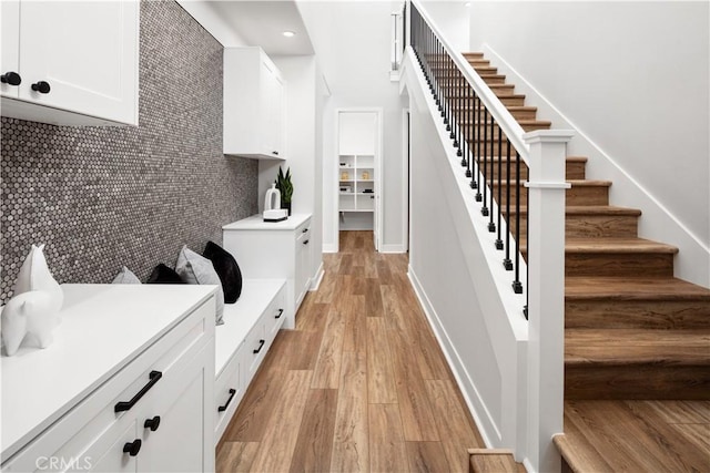 interior space with recessed lighting, baseboards, and light wood finished floors