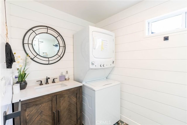 11894 Truro Ave, Hawthorne, CA 90250 - bathroom with stacked washer / dryer, vanity, and wooden walls