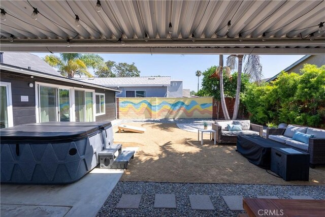 11894 Truro Ave, Hawthorne, CA 90250 - view of patio featuring fence private yard, outdoor lounge area, and a hot tub
