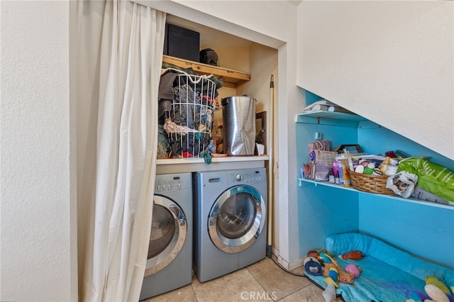 laundry room with tile patterned floors, laundry area, and washer and dryer